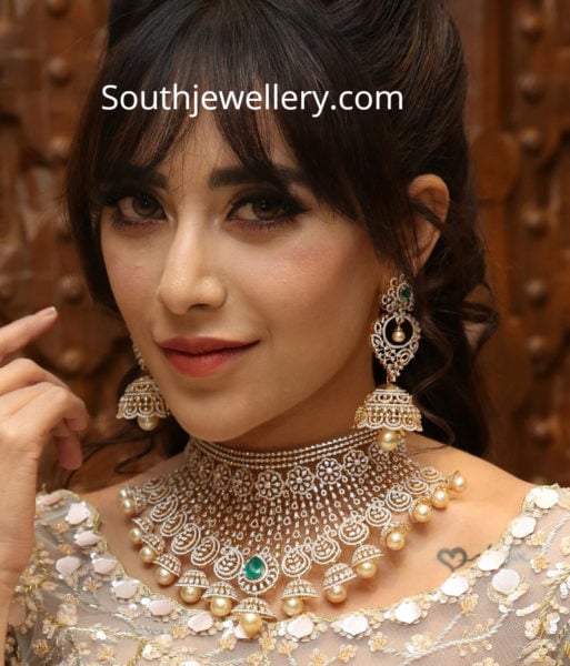 diamond emerald choker and jhumkas 